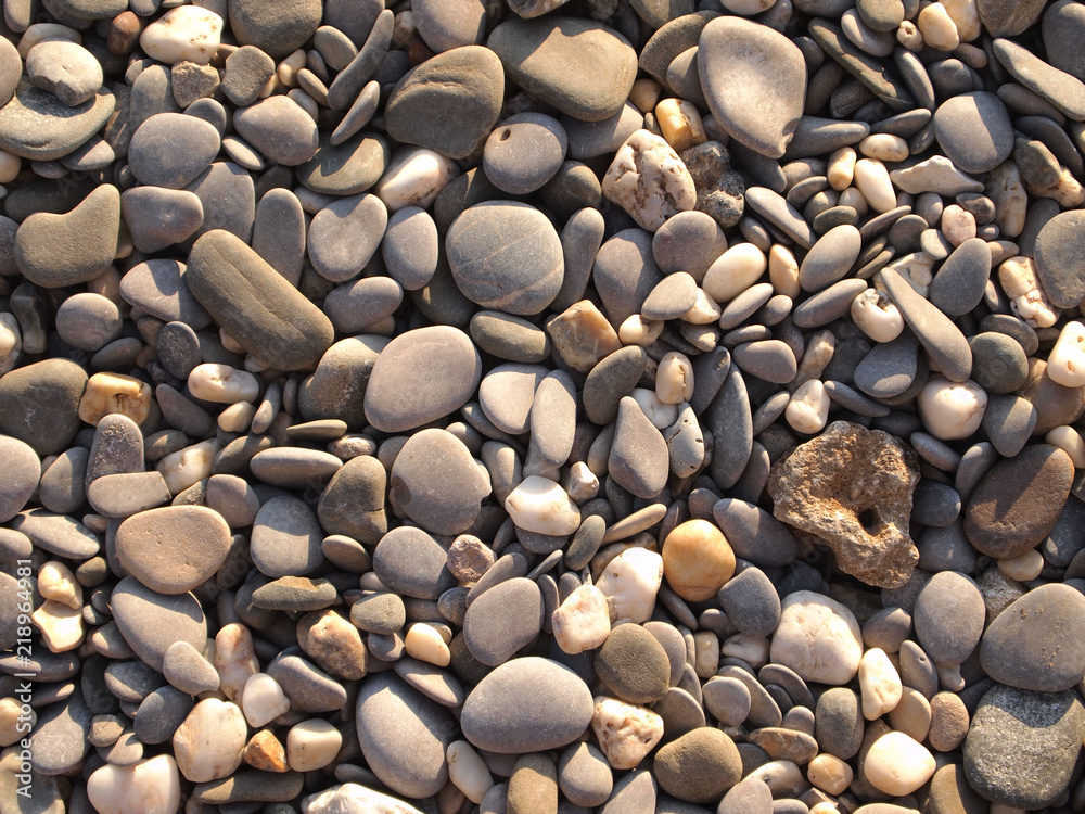 Pebbles, stone texture, natural abstract background. Sea pebbles, close-up. Pebbles, stone texture, natural abstract background. Sea pebbles, close-up.
