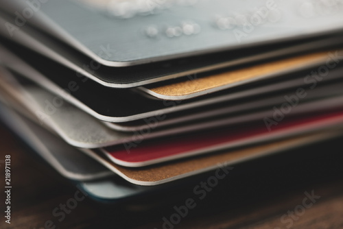 Stack of multicolored credit cards close-up 