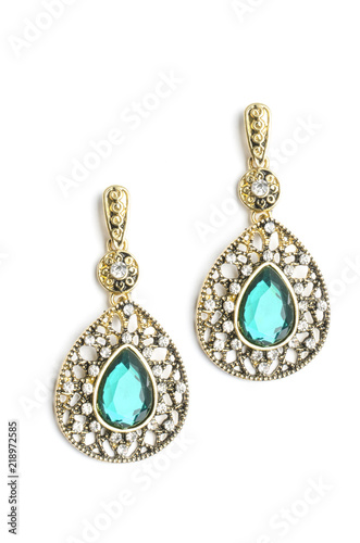 gold drop earrings with blue stone isolated on white