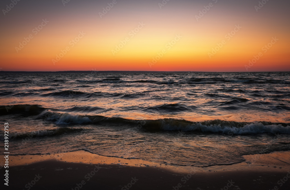 Beautiful landscape with sea and sunset sky. Composition of nature