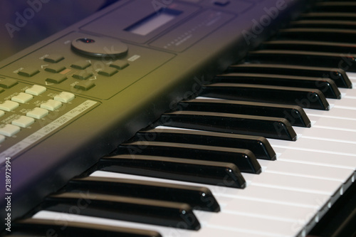 Close up of keys of an electric piano in perspective