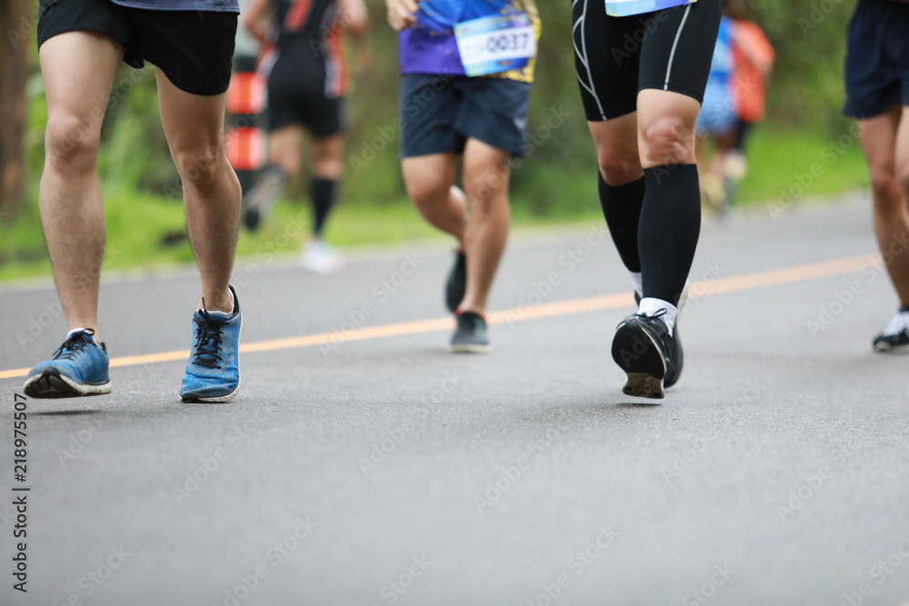 Group of people running race marathon