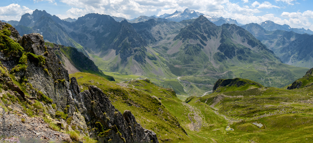 view of Pyrenees mountains with cloudy blue sky view of Pyrenees mountains with cloudy blue sky