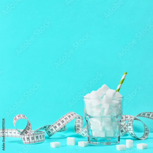 Valokuva Sugar cubes measuring tape Weight control diet detox blue