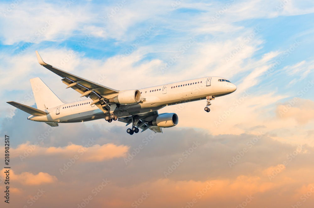 Passenger plane approach landing from the runway before the light from the sunshine. Passenger plane approach landing from the runway before the light from the sunshine.
