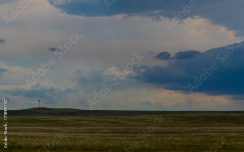 A Windmill Standing on a Hill as a Storm Approaches in the Fields of the Pawnee National Grasslands