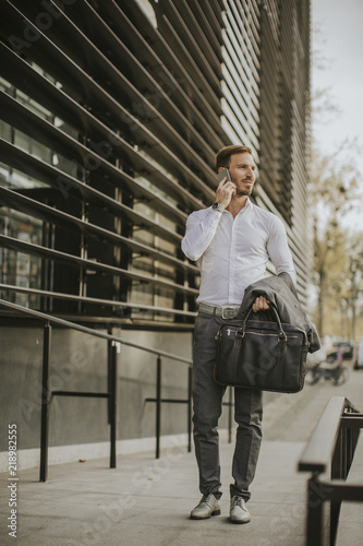 Stylish businessman walking outdoors