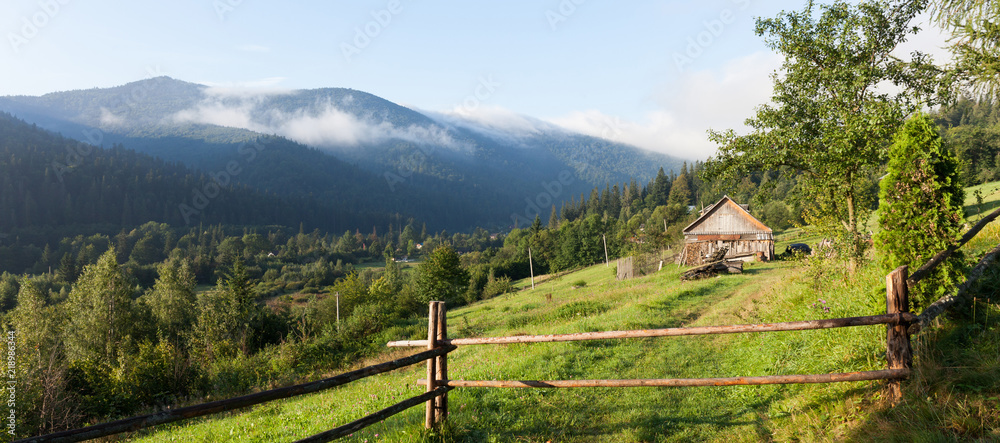 House in mountain village, forest nature landscape.