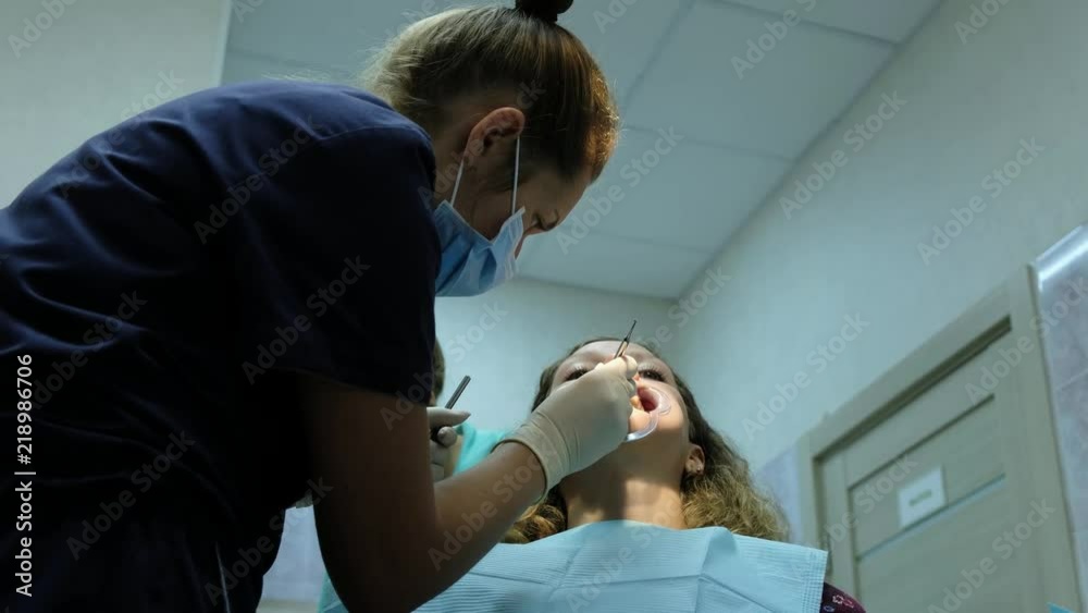 Installation of braces. Visit to the dentist orthodontist, correction of malocclusion, treatment teeth Installation of braces. Visit to the dentist orthodontist, correction of malocclusion, treatment teeth