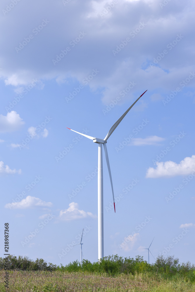 Beautiful landscape with windmills in the distance Beautiful landscape with windmills in the distance