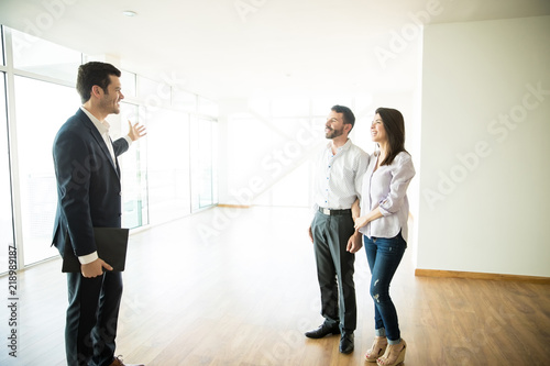 Real Estate Broker Showing Couple A New House