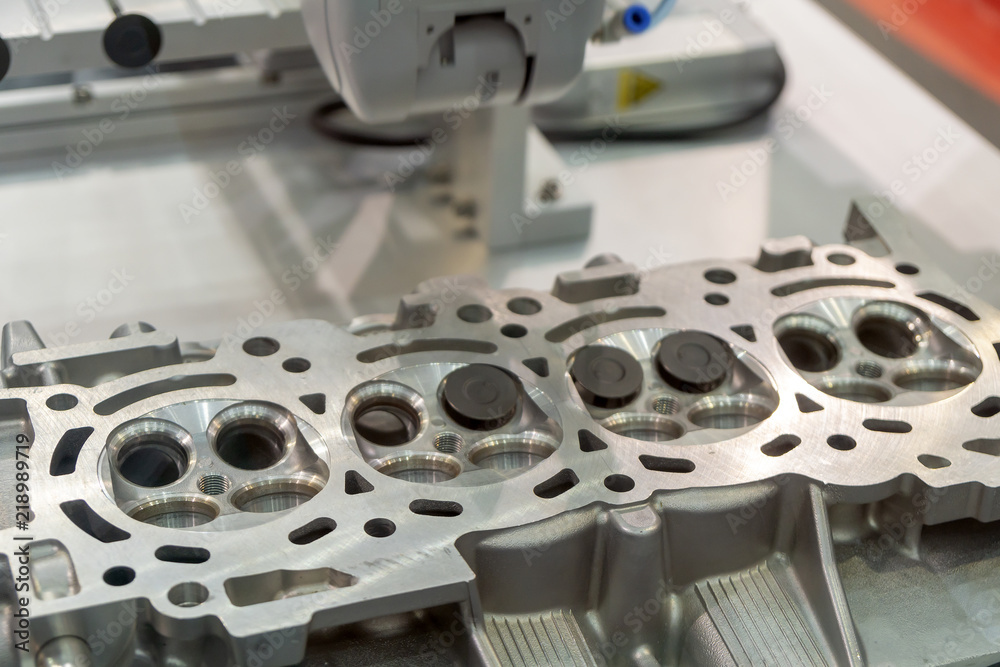 The boring machine make the hole at the cylinder head .Automotive part manufacturing process . The boring machine make the hole at the cylinder head .Automotive part manufacturing process .