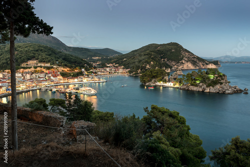 Panoramic view of the resort town of Parga  the harbor  the beach and islets at sunset  region of Epirus  Greece 