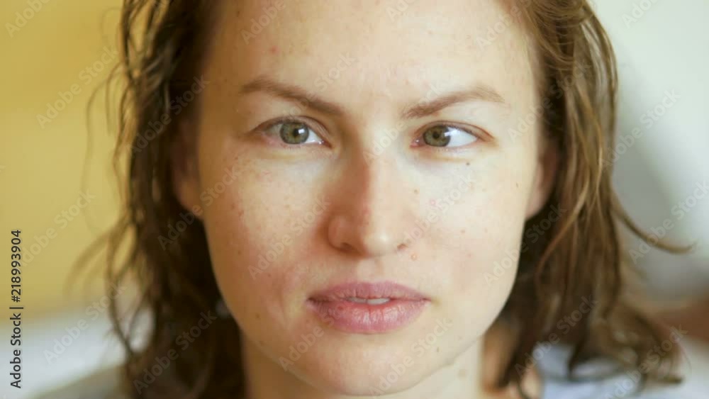 A large portrait of a young woman with a vision problem, strabismus, nearsightedness. Symptoms of ophthalmic diseases A large portrait of a young woman with a vision problem, strabismus, nearsightedness. Symptoms of ophthalmic diseases