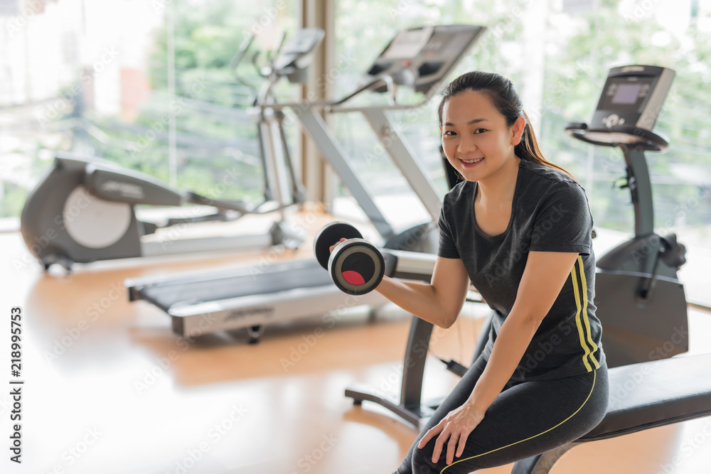 Fototapeta premium happy Asian woman exercise in gym