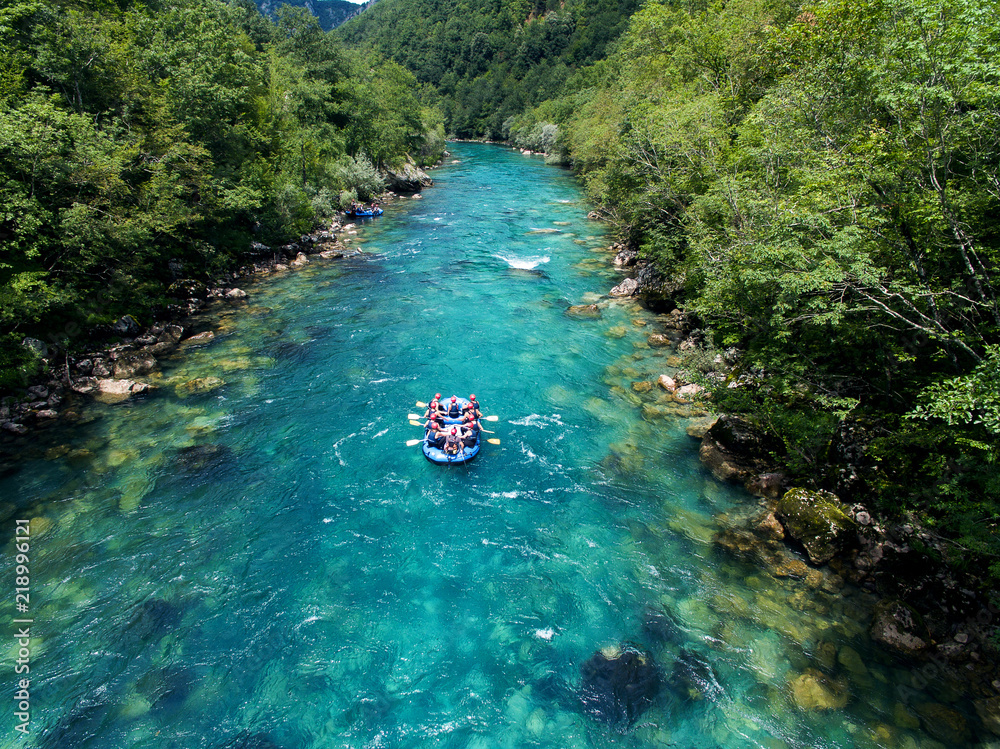  Rafting on the beautiful mountain river. Aerial view of rafting boat on amazing blue river - obrazy, fototapety, plakaty 