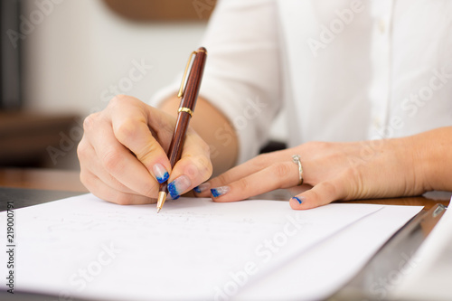 Business woman signing important documents