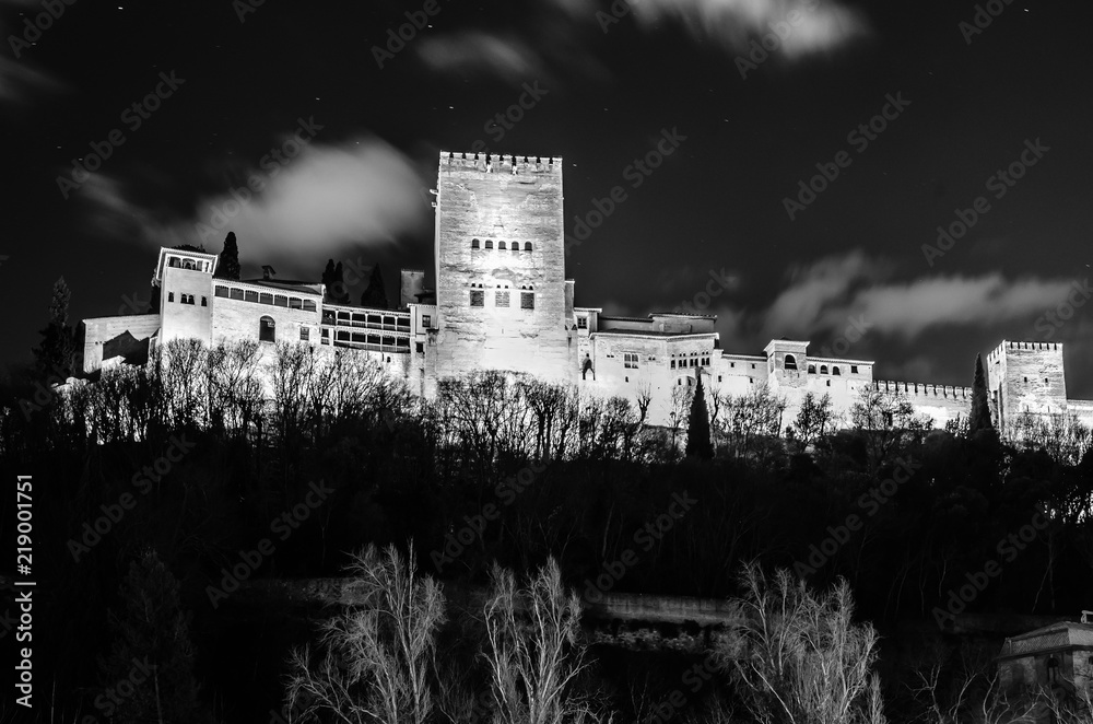 Night cityscape of Granada, Spain, with the Alhambra Palace in the background Night cityscape of Granada, Spain, with the Alhambra Palace in the background