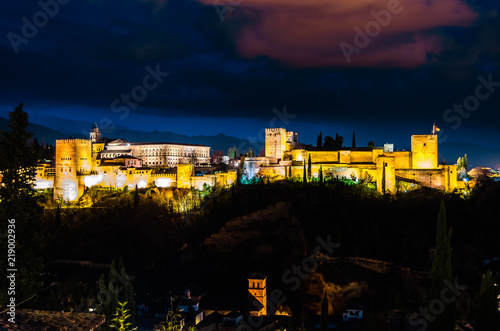 Fototapeta Naklejka Na Ścianę i Meble -  Night cityscape of Granada, Spain, with the Alhambra Palace in the background