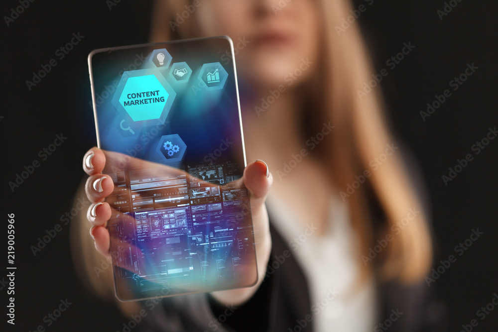 The concept of business, technology, the Internet and the network. A young entrepreneur working on a virtual screen of the future and sees the inscription: Content marketing