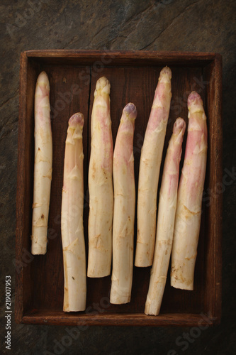 preparing fresh white asparagus spears photo