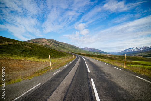 Typical Icelandic landscape with asphalt road. 