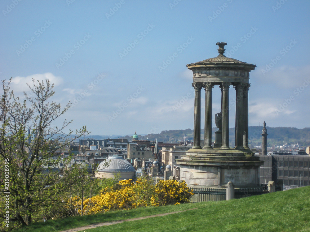 Dugald Stewart Monument with green vegetation around, in Edinburgh