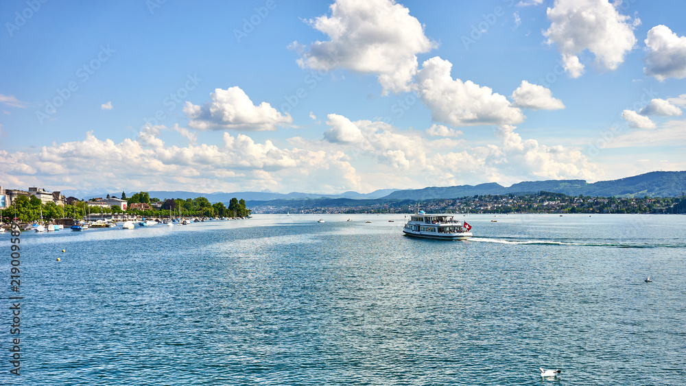 Tourism at Lake of Zurich in Switzerland / Relaxed people, Swans, Boats, Sunshine