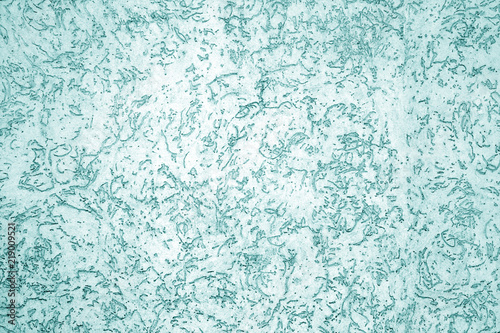 Cement wall texture in cyan tone.
