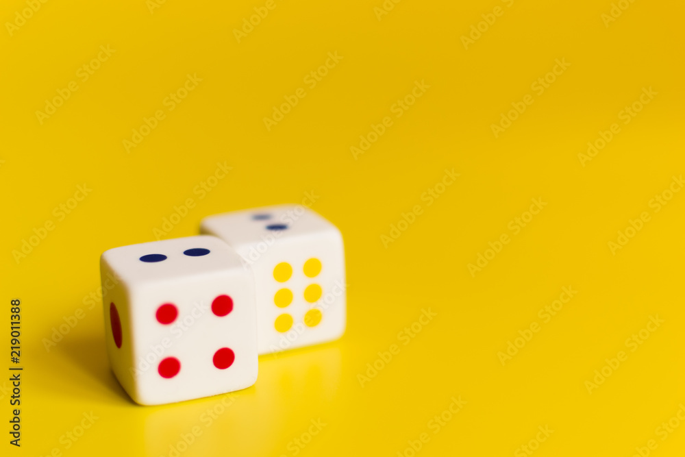 white dice on yellow background white dice on yellow background