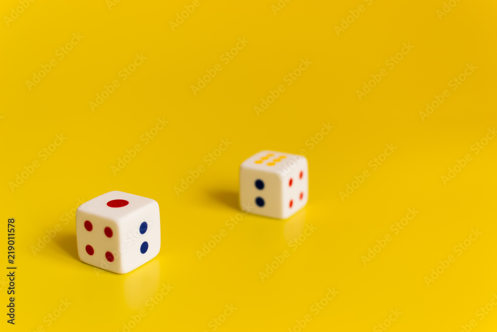 white dice on yellow background white dice on yellow background