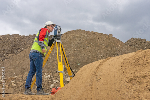 Topographical survey of the terrain by a surveyor