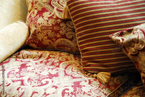Close up of beautiful red and gold fabrics and cushions