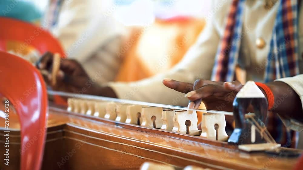 Cambodian man plying on traditional Khmer instrument called Chakhe ...