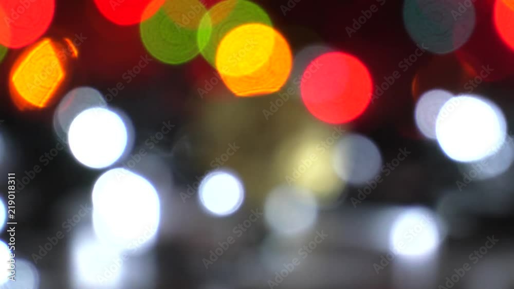 Physical golden Bitcoin. Festive atmosphere. Colorful Christmas tree lights in the background. BTC is a cryptocurrency and is the first decentralized peer-to-peer payment network. Physical golden Bitcoin. Festive atmosphere. Colorful Christmas tree lights in the background. BTC is a cryptocurrency and is the first decentralized peer-to-peer payment network.