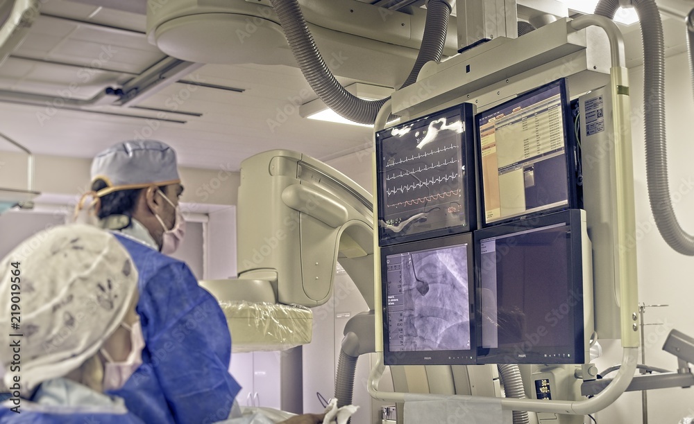 The doctor performs coronary stenting in a patient with a myocardial infarction      