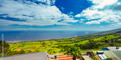 Panorama over the vast sugar cane fields on the high slopes of the west of Reunion Island