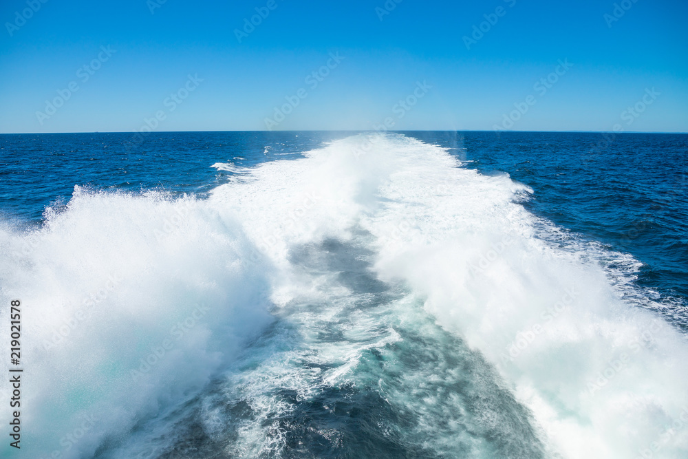 Trail print on water surface behind of speed boat or Fast catamaran Trail print on water surface behind of speed boat or Fast catamaran