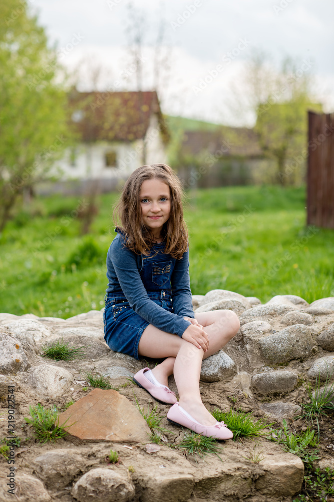 brunette brown hair teenage girl in denim spring outdoor brunette brown hair teenage girl in denim spring outdoor
