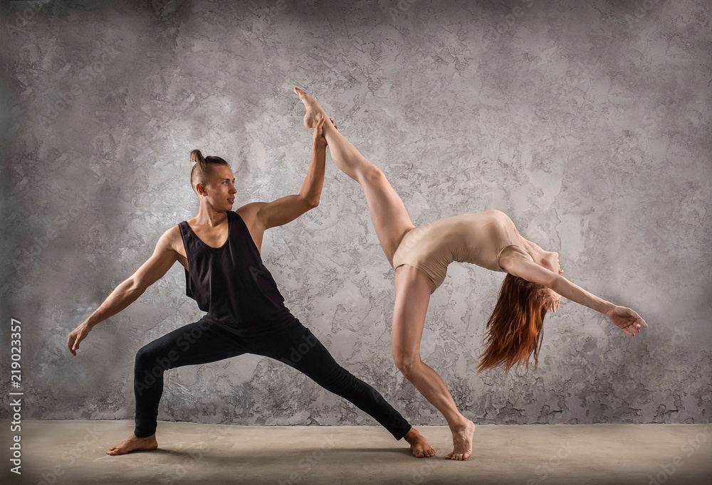 Modern Ballet Dancer Young Couple in Black Posing. Duet Perform Active Art  Element. Caucasian Beautiful Girl make Arch, Handstand. Fit Body Man in  Plie Isolated on White Background Stock Photo | Adobe