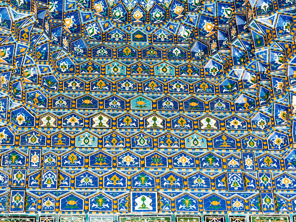 Geometric decoration of Islamic architecture. Detail of mosaic of ceramic tiles in Registan Square. Samarkand, Uzbekistan