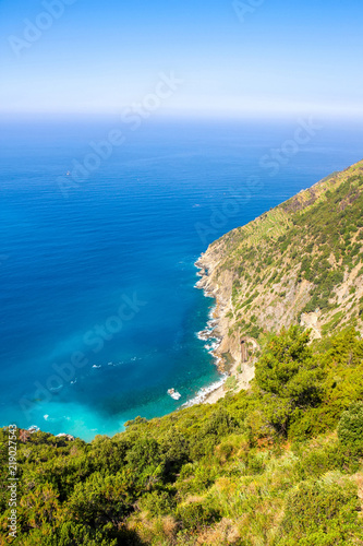 Rocks in the blue Mediterranean Sea on a bright sunny day.