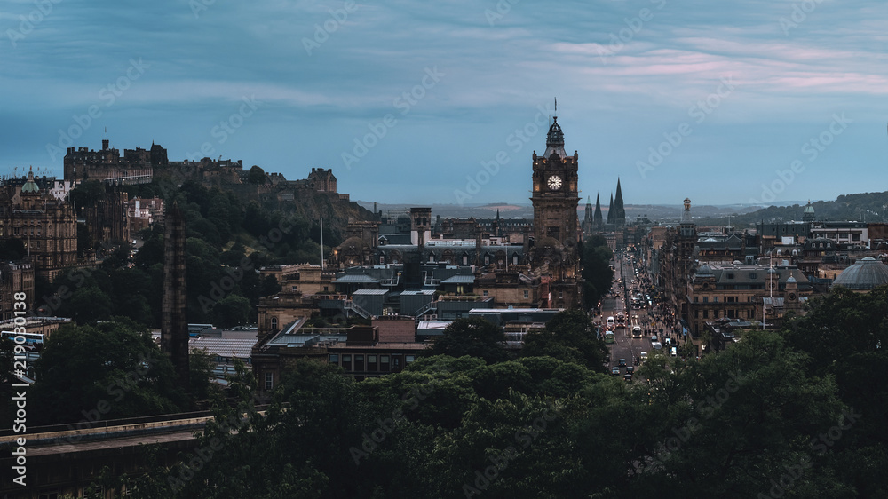 Evening panorama of the city Edinburgh, view of the clock tower and Princes Street and Edinburgh Castle, Edinburgh, Scotland, United Kingdom