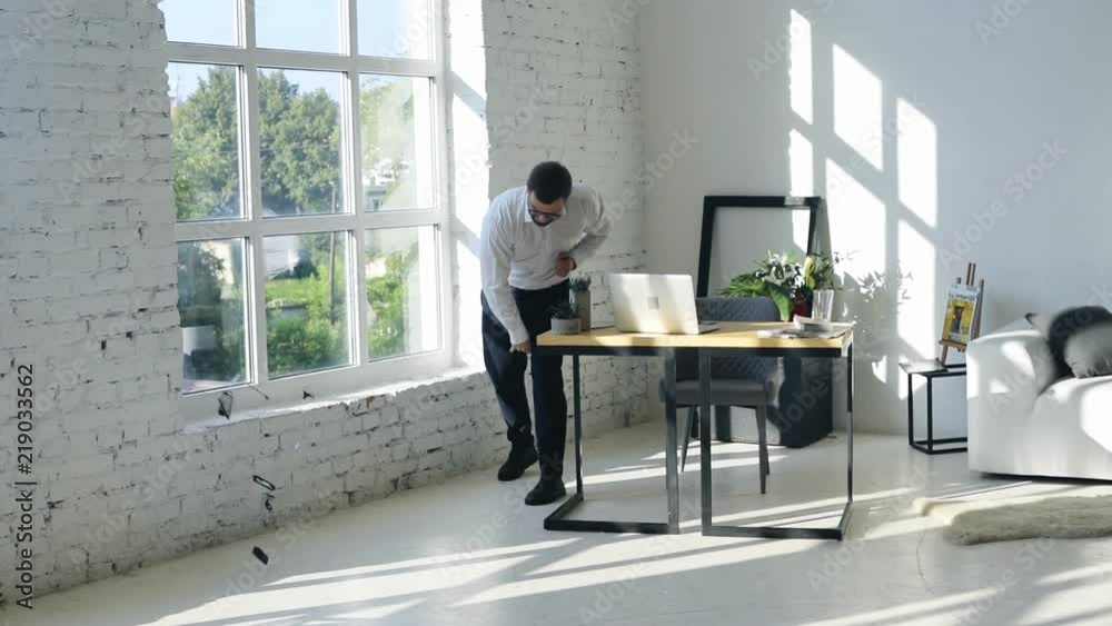 angry businessman in modern office talking and then throwing his mobile phone on the floor swearing crushing smartphone after a phone call businesspeople disagreement stress business conflict quarrel angry businessman in modern office talking and then throwing his mobile phone on the floor swearing crushing smartphone after a phone call businesspeople disagreement stress business conflict quarrel