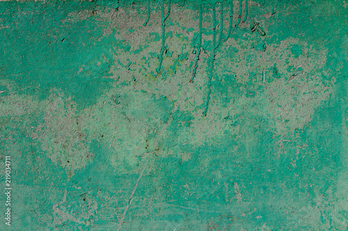 Old texture turquoise blue cracked wall, the old paint texture is chipping and cracked fall destruction. Grunge wall texture.
