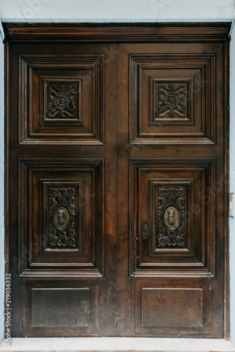A beautiful old self-made wooden door in Spain. Chocolate color 