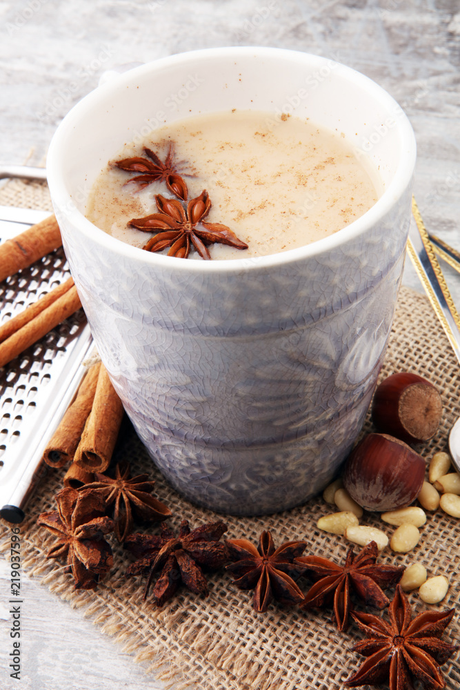 Masala tea in ceramic cup with winter spices. Masala tea in ceramic cup with winter spices.