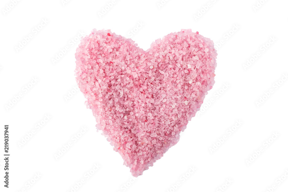 Heart of pink sea salt on a white background isolate