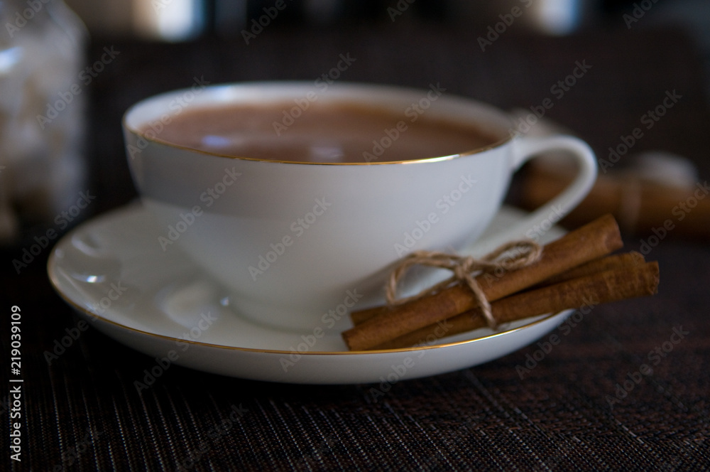 Cup of Cocoa, Cinnamon Sticks and Sugar Cubes Cup of Cocoa, Cinnamon Sticks and Sugar Cubes