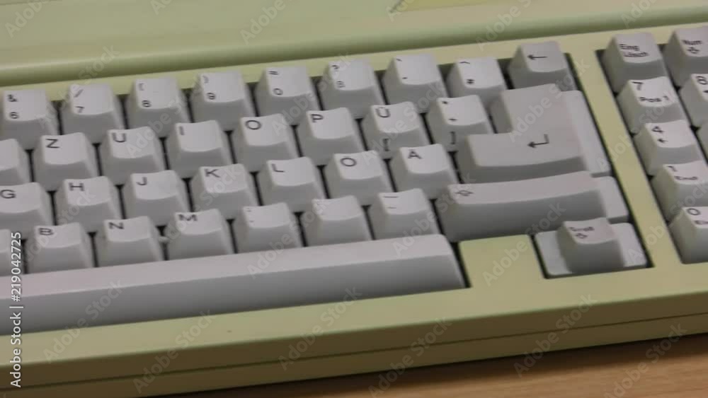 White computer keyboard. Computer or game console from the 90s. Old retro style. , Panning, closeup. White computer keyboard. Computer or game console from the 90s. Old retro style. , Panning, closeup.